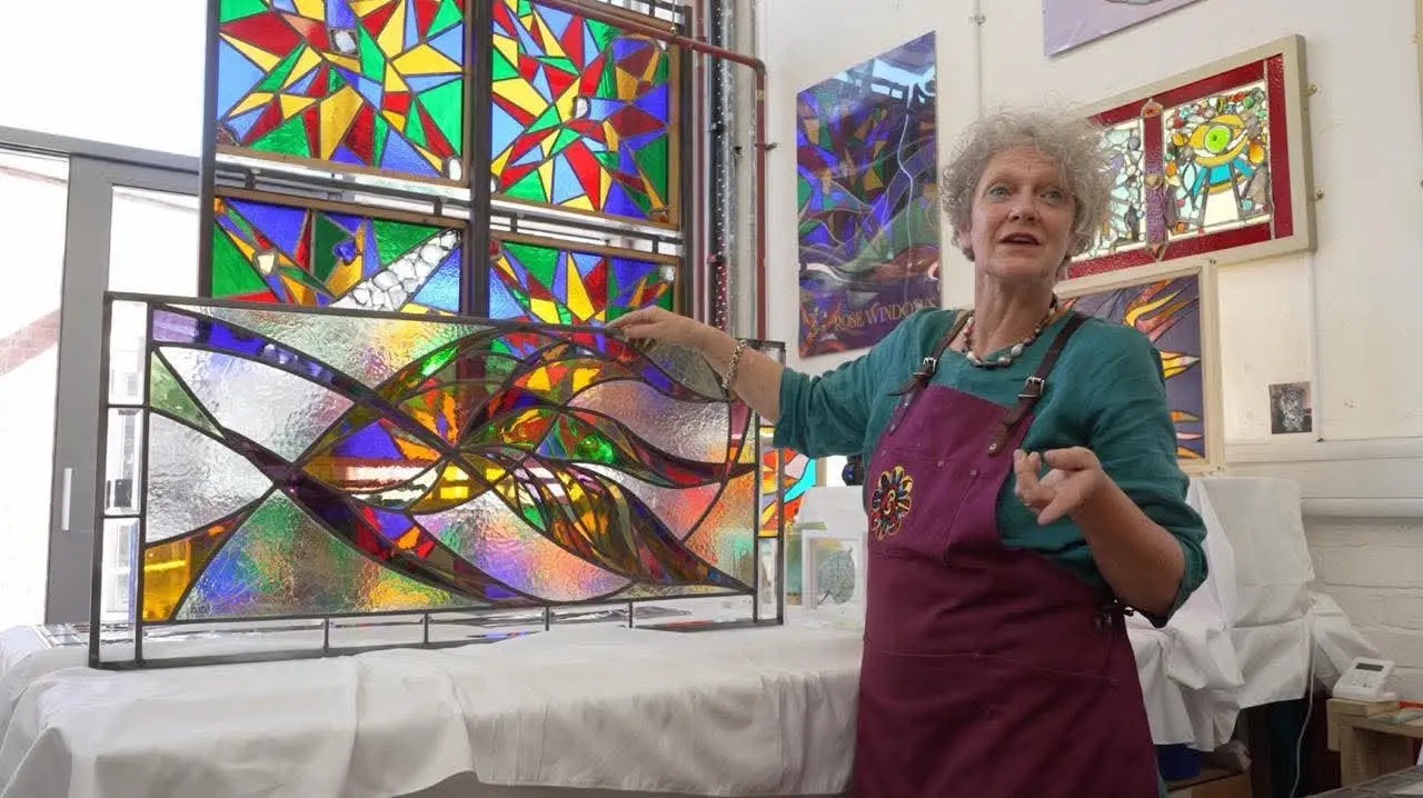 A stained glass artist at work. 